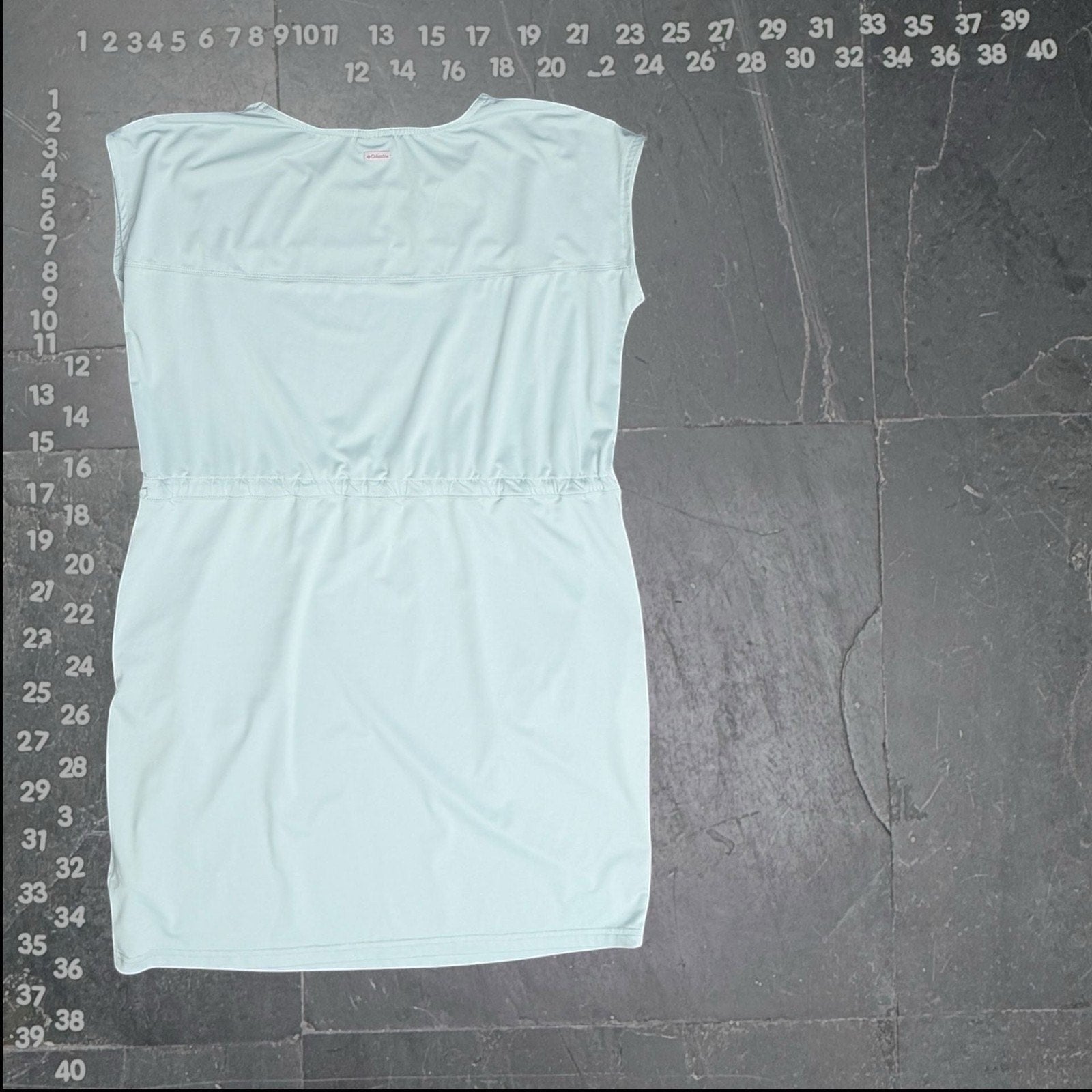 Columbia spray green sleeveless drawstring waist dress. Lightweight, breathable, and adjustable silhouette for versatile wear.