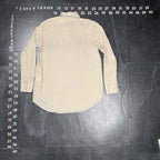 Detail view of Club Monaco women's beige crinkle cotton button-down shirt, size XS.