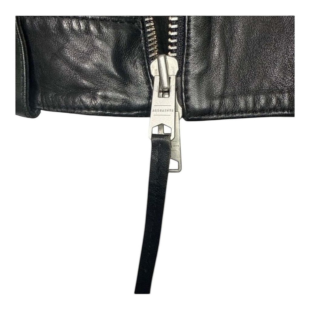 The Room Collective black leather biker jacket with asymmetric zip and AllSaints branding on zipper pull.