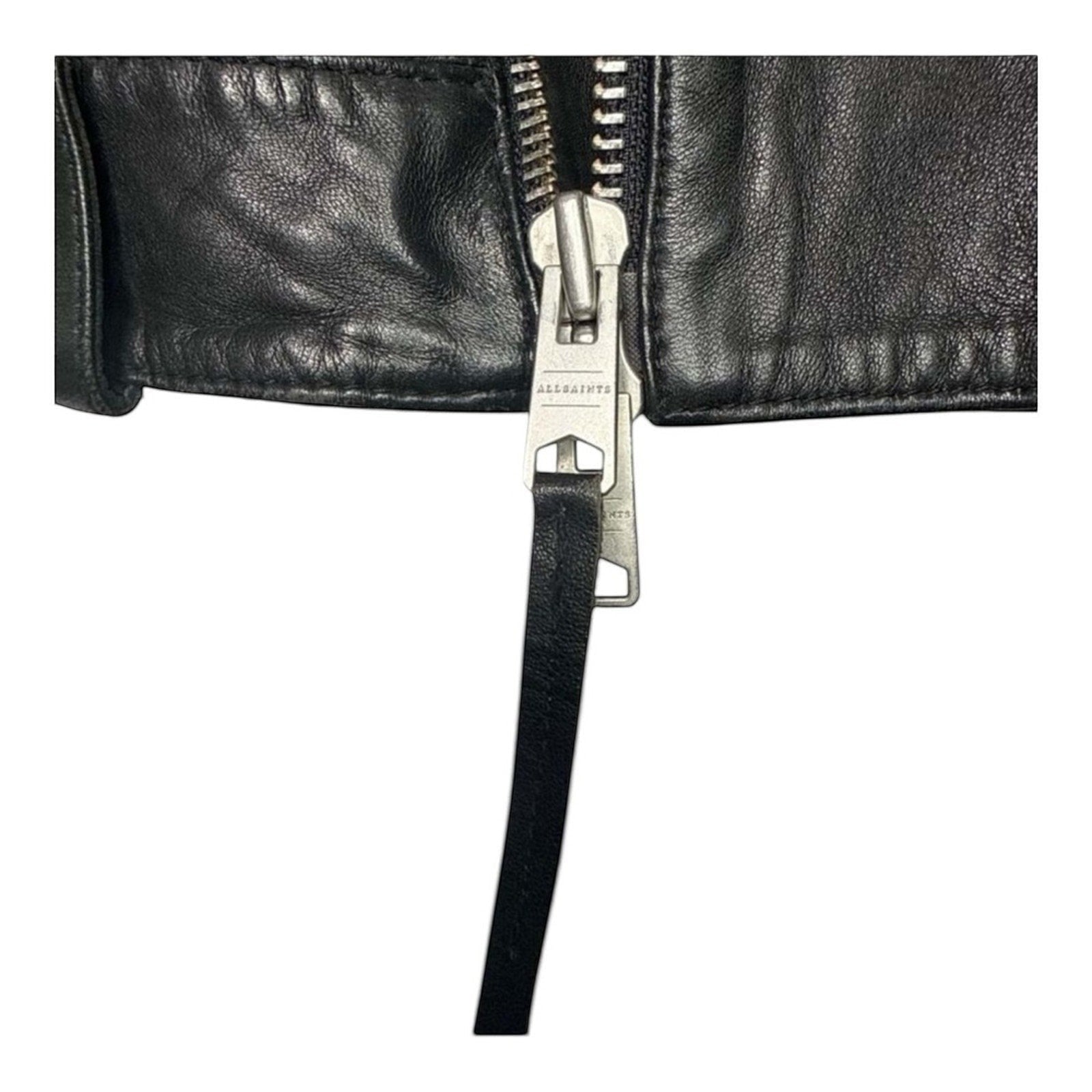 The Room Collective black leather biker jacket with asymmetric zip and AllSaints branding on zipper pull.