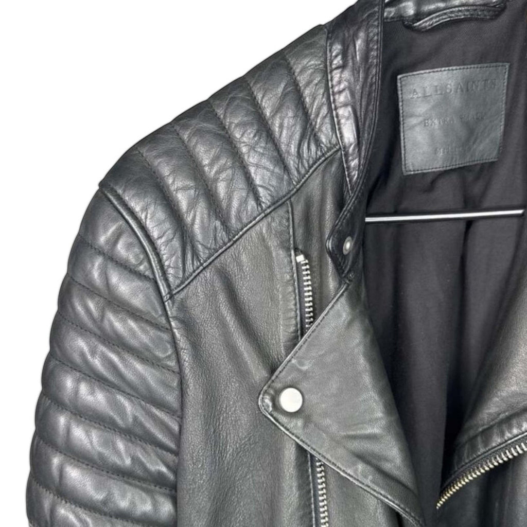 The Room Collective black leather biker jacket with quilted shoulders and asymmetric zip front.