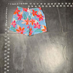 The Room Collective light blue swim trunks with pink and orange floral print, size small, elastic waistband, drawstring, and pockets.