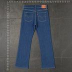 The Room Collective Levi's Women's Bootcut Denim Jeans in mid-blue wash denim. Features a mid-rise waist and classic five-pocket styling.