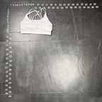 The Room Collective white Lululemon Free to Be Serene bra with strappy back detail, size M. Made from nylon and spandex blend.