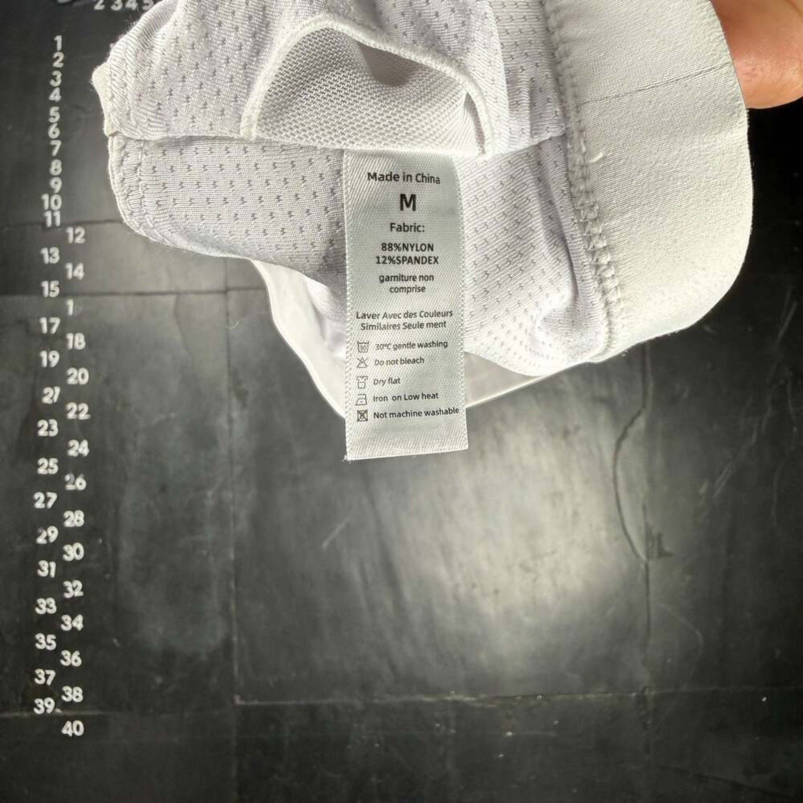 The Room Collective white Lululemon Free to Be Serene Bra, size M, with strappy back detail and mesh lining.