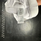 The Room Collective white Lululemon Free to Be Serene Bra, size M, with a strappy back detail and breathable mesh lining.