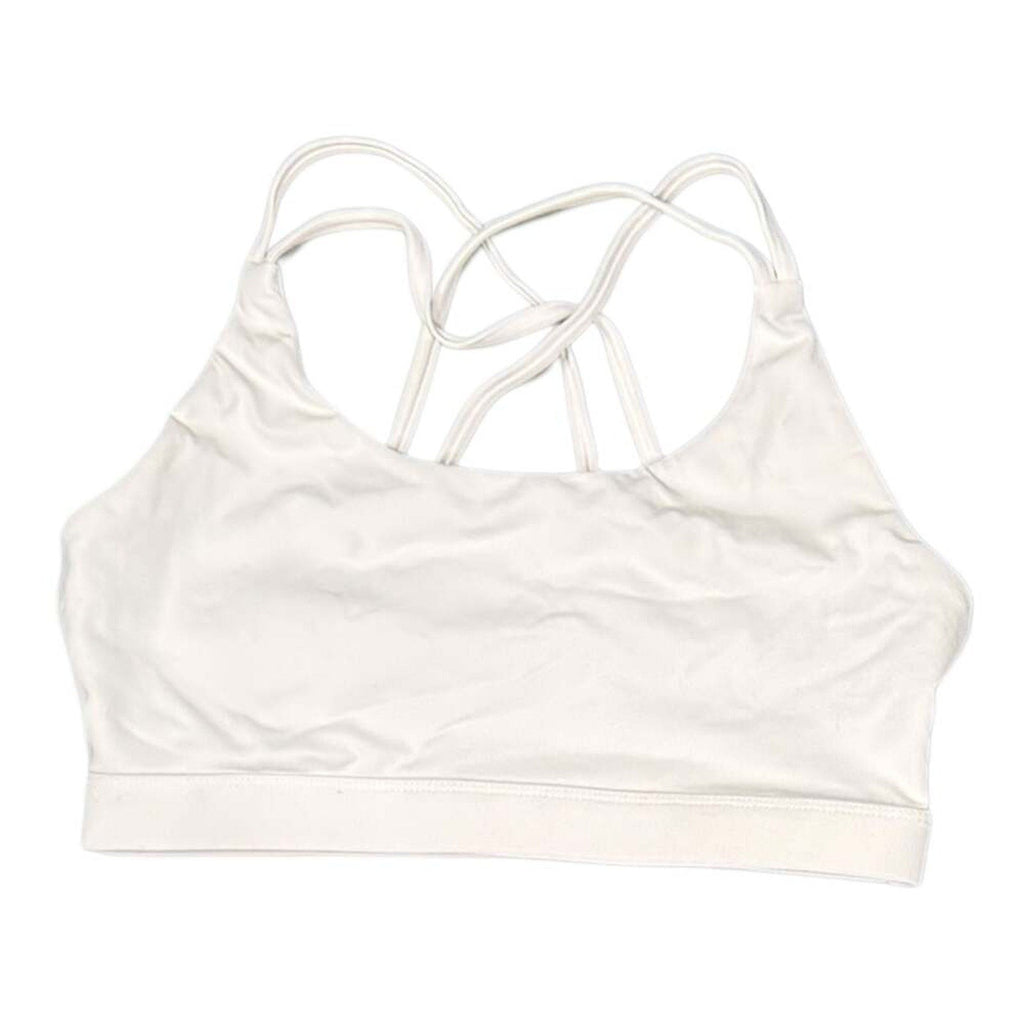 The Room Collective white Lululemon Free to Be Serene bra with strappy back detail, size M. Light support for yoga.