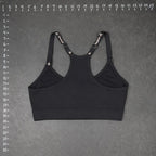 The Room Collective Reebok black logo strap sports bra, size S. Racerback design with adjustable straps.