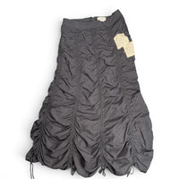 The Room Collective Riley black ruched nylon parachute skirt with adjustable hem and vintage labels. Size S.