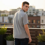 The Room Collective AllSaints grey short sleeve button-down shirt with textured fabric and Ramskull logo detail. Men's size L.