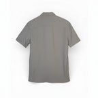 The Room Collective AllSaints Huntingdon grey short sleeve button-down shirt with Ramskull logo, size L. Textured cotton blend fabric.