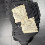 The Room Collective Riley black ruched nylon parachute skirt with vintage instruction labels and drawstring hem. Size S.