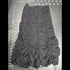 The Room Collective Riley black ruched nylon parachute skirt with adjustable drawstring hem and back zipper closure. Size S.