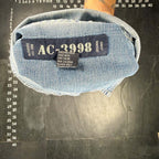The Room Collective AC-3998 light wash denim trucker jacket with distressed details and "Est. 1998" tag.