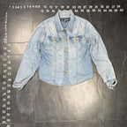 The Room Collective AC-3998 light wash denim trucker jacket with distressed cuffs and hem, gold-tone buttons, and dual chest pockets.