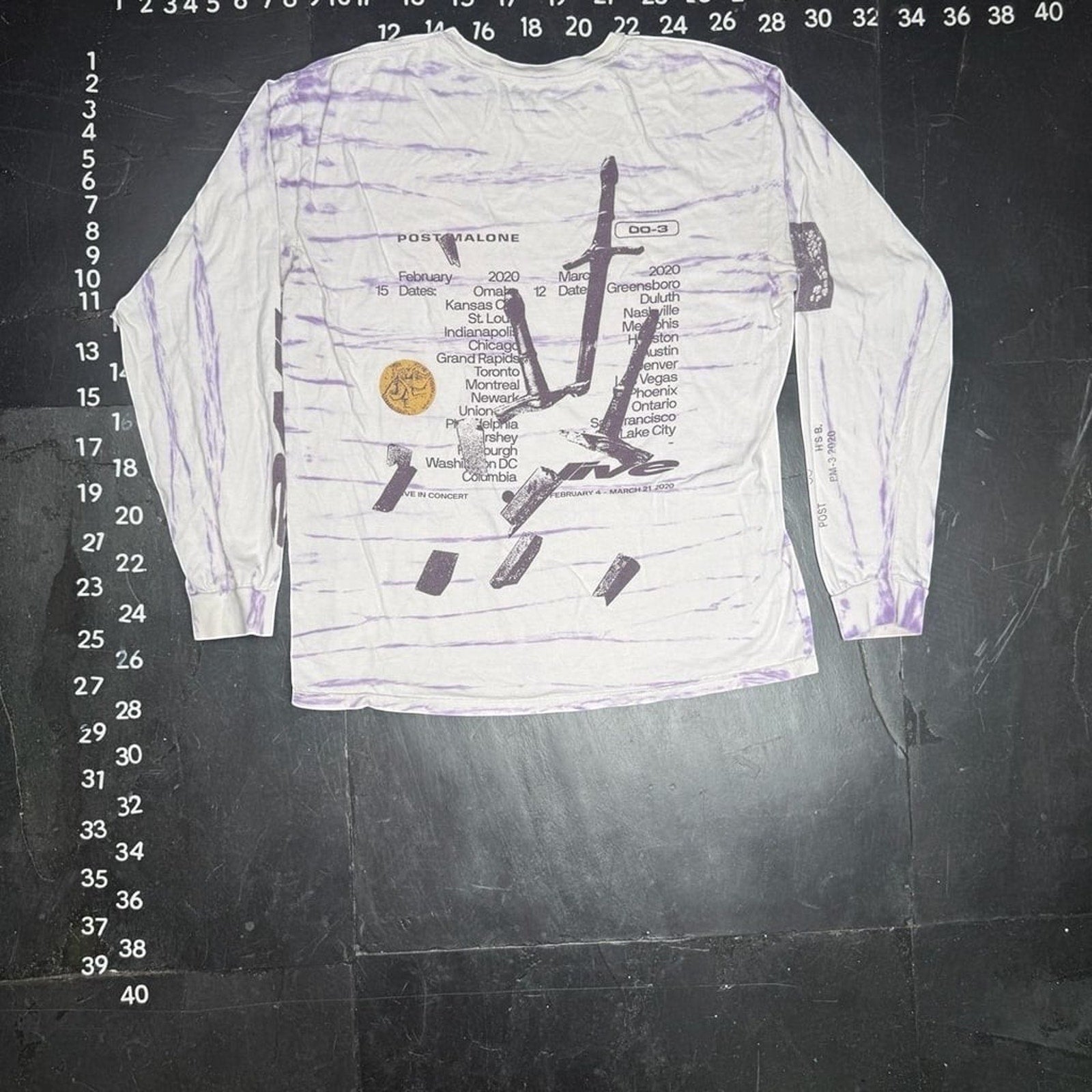 The Room Collective Post Malone Hollywood's Bleeding Runaway Tour 2020 tie-dye long sleeve shirt in purple and white, size Large. Features tour dates and graphics.
