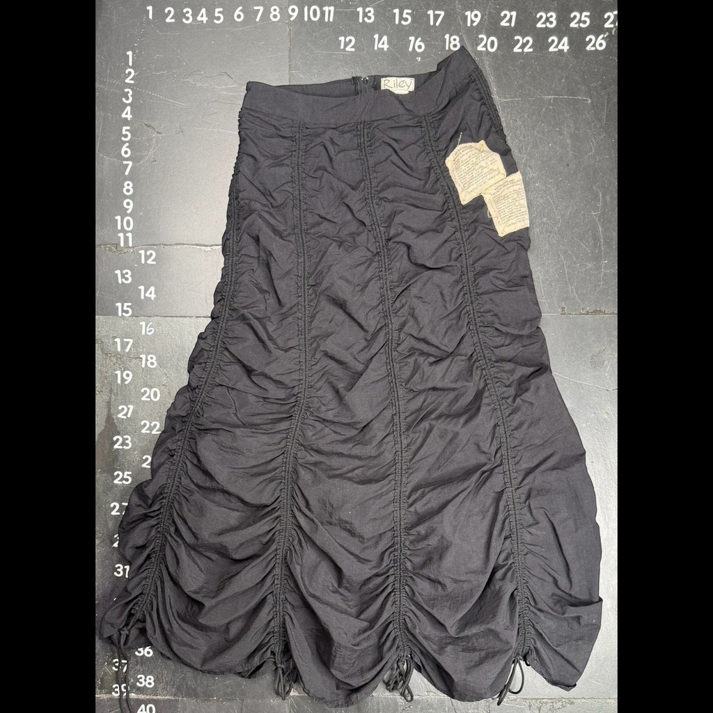 The Room Collective Riley black ruched nylon parachute skirt with adjustable drawstring hem and vintage labels. Size S.
