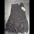 The Room Collective Riley black ruched nylon parachute skirt with adjustable drawstring hem and vintage labels. Size S.